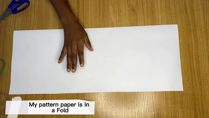 Measure down to the desired sleeve length (e.g., 8 inches for short sleeve). Draw a line across.