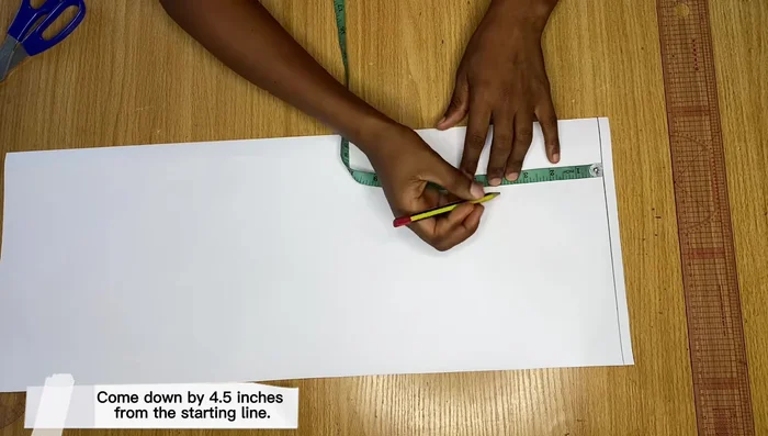 Measure down to the desired sleeve length (e.g., 8 inches for short sleeve). Draw a line across.