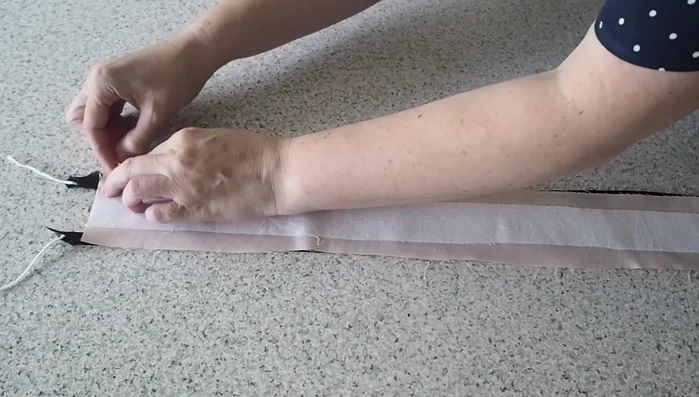 Sew belt pieces together: Place right sides of both fabric pieces together, stitch with piping foot through all layers.