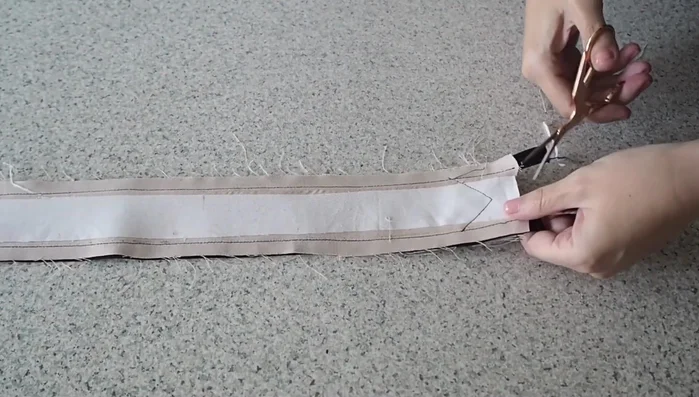 Turn right side out: Trim excess fabric, turn the belt right side out, using a loop turner or similar tool to help with corners.