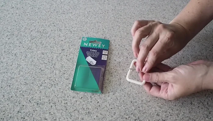 Attach buckle: Feed the fabric-covered buckle through the belt and hand stitch to secure.