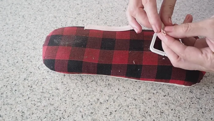 Attach buckle: Feed the fabric-covered buckle through the belt and hand stitch to secure.