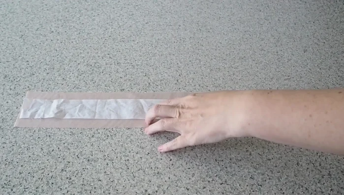 Add interfacing: Apply press-on cotton interfacing to both fabric pieces for structure.