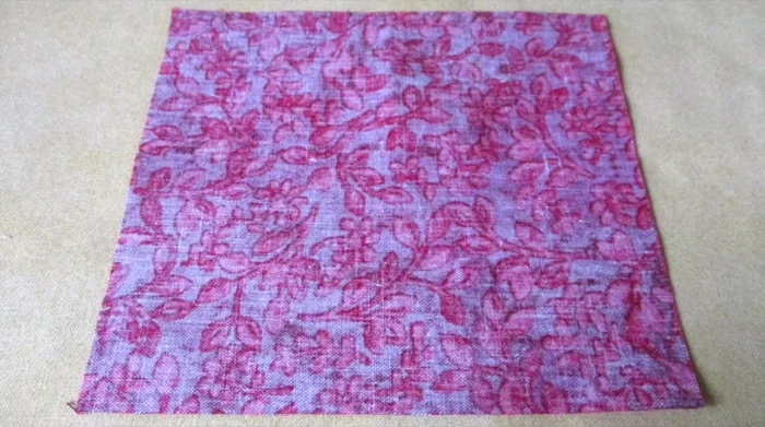 Center the template on the fabric stack and pin it in place.