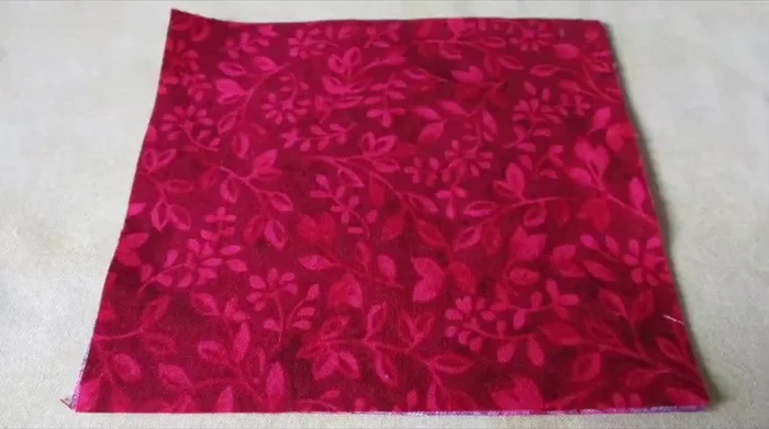 Center the template on the fabric stack and pin it in place.