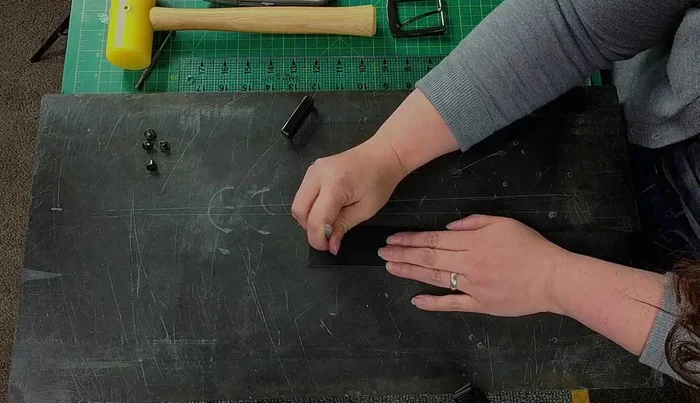 Mark and punch matching holes on the backside of the belt to ensure perfect alignment of Chicago screws.