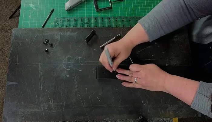Mark and punch matching holes on the backside of the belt to ensure perfect alignment of Chicago screws.