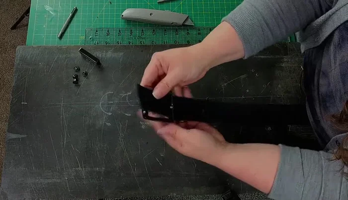 Install the belt buckle, ensuring the post fits smoothly through the opening. Use a mallet to neatly set the buckle.