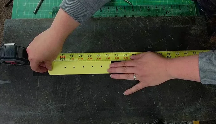 Add additional holes along the belt for adjustability. Use a template for consistent spacing or measure directly onto the user’s existing belt.