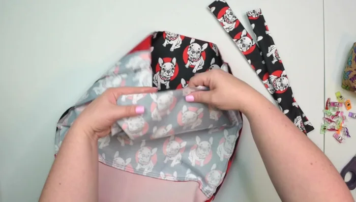 Attach casings: Mark midpoints, align midpoints of casing and backpack, clip, baste.