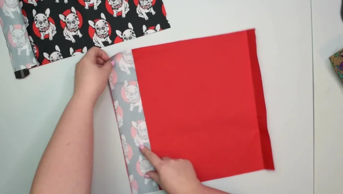 Attach second zipper pocket: Place second zipper pocket and facing right sides together, clip, sew 1cm seam allowance, press, topstitch.