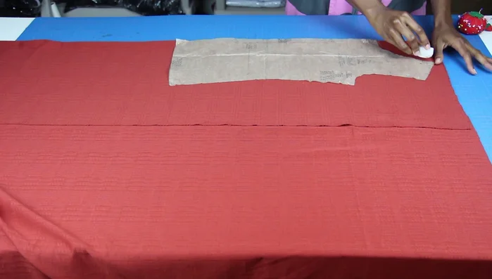 Trace the front pattern piece onto your fabric, making adjustments for the desired dress length. Mark your hip and waistline on the pattern and add length accordingly.