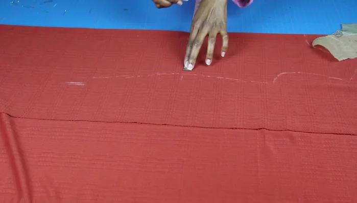 Draw a diagonal line from hip to hem, using your measurements as a guide to create the dress's A-line shape. Cut along this line to adjust the hem width.