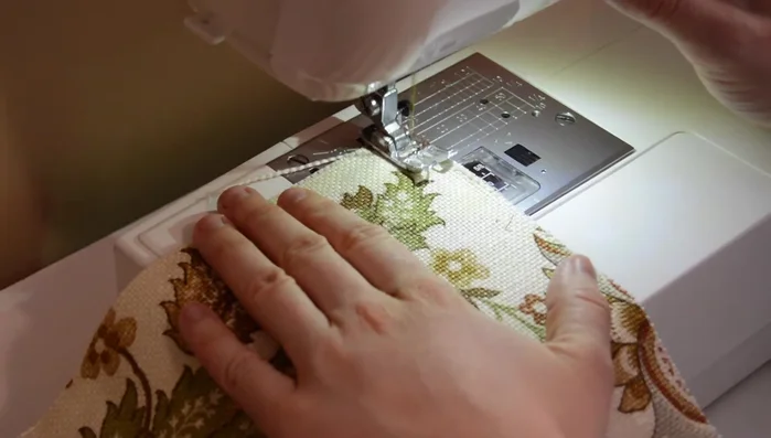 Prepare base pieces: Finish raw edges with a zigzag stitch. If using a zipper, sew a 5/8-inch seam, press open, pin the zipper, and sew it in place.