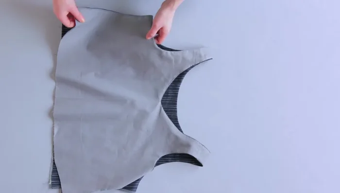 Sew the side seams with right sides together. Pin the side seam of the lining and the main fabric bodice. Stitch in one go from the lining through to the main fabric bodice. Press seam allowances open and repeat for the other side.