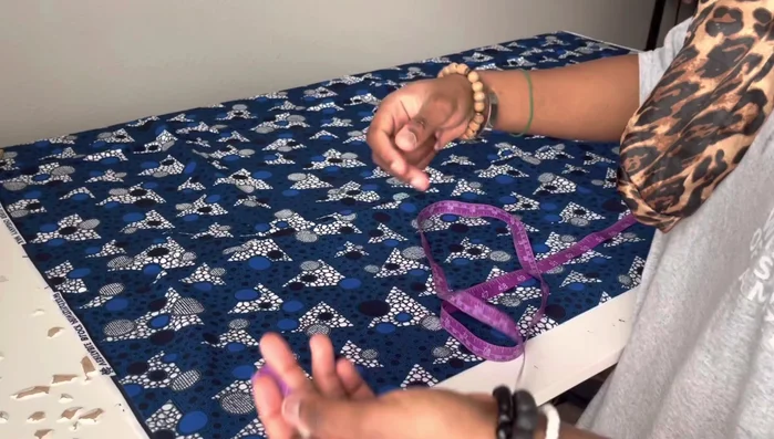 Mark the hip measurement on the folded fabric, dividing by four and adding seam allowance.