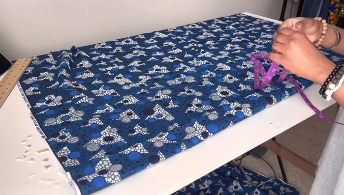 Mark the hip measurement on the folded fabric, dividing by four and adding seam allowance.