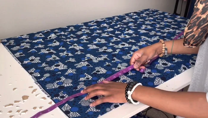 Mark the hip measurement on the folded fabric, dividing by four and adding seam allowance.