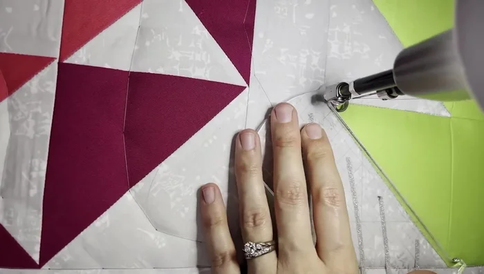 Offset quilting: Stitch a quarter-inch offset line from the outlining seams, creating a parallel line around the maple leaf.