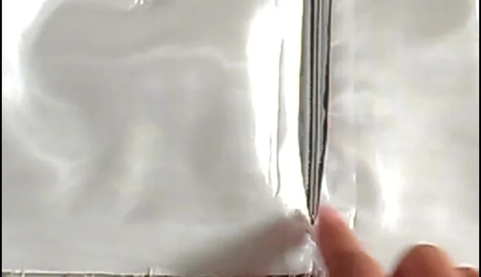 Sew lining to zipper: Sew the lining to the zipper, paying attention to keep the center back seams aligned at the opening. Note that near the zipper pull, you might need to stop sewing, close the zipper, then continue sewing.