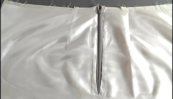 Join skirt and lining: With right sides together, sew the front skirt to the back skirt at the side seams, leaving the lining free. Then, with right sides together, sew the front lining to the back lining at the side seams.