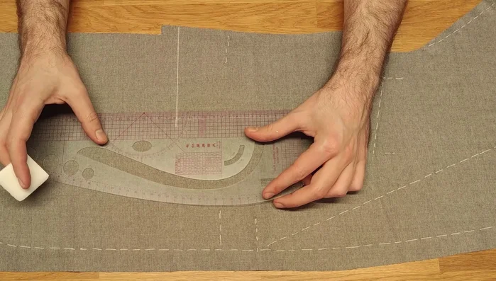 Cut about 1/3 of the dart length. Fold it in half with the base outside the chalk line for basting.