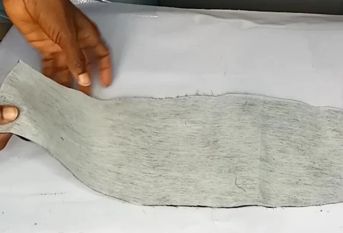 Iron the interfacing onto the wrong sides of both fabric pieces.