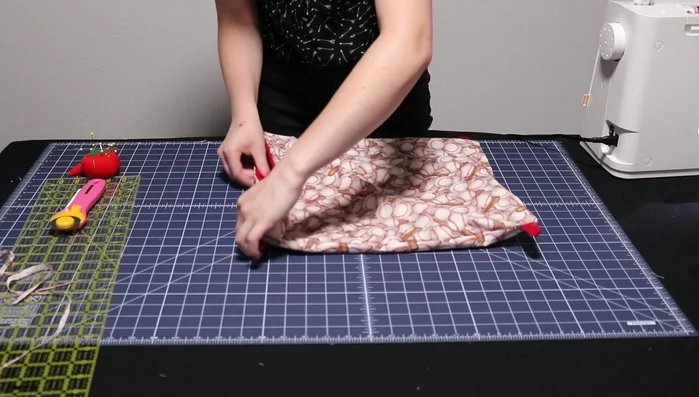 Stitch two lines along the top edge (one at the very top, another one inch below) to create channels for the drawstring.