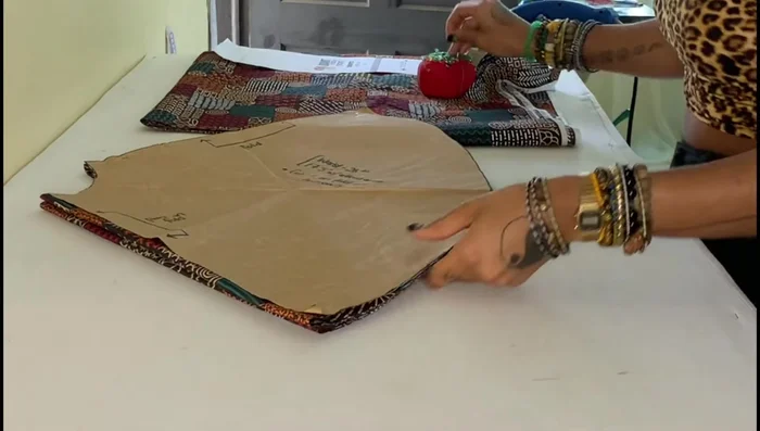 Cut one large circle down one fold to create the front piece.