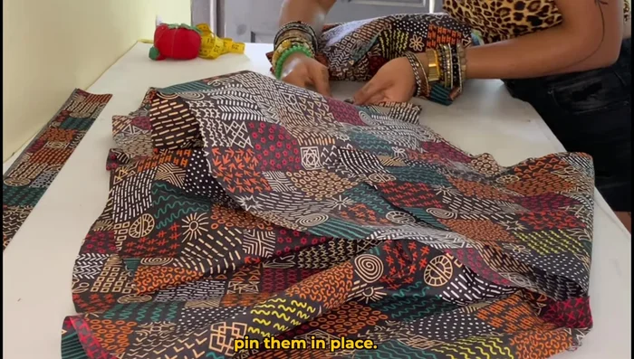 Pin and sew the front and back pieces together, using a 1/2 inch seam allowance and serger to finish edges.