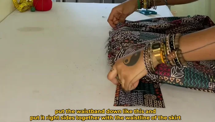 Sew the waistband and skirt together with a 1/2 inch seam allowance.