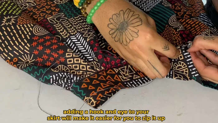 Add a hook and eye closure for extra security.