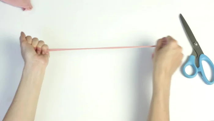 Tie the headband to cardstock (optional) for easier handling.