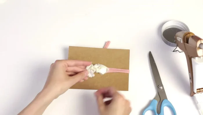 Glue the prepared flower to the headband.