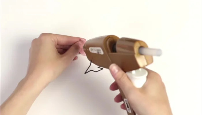 Glue the chiffon flower to the headband next to the white flower. Add pearls and dry flowers as desired.