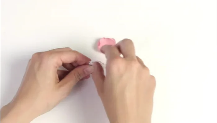 Glue the chiffon flower to the headband next to the white flower. Add pearls and dry flowers as desired.