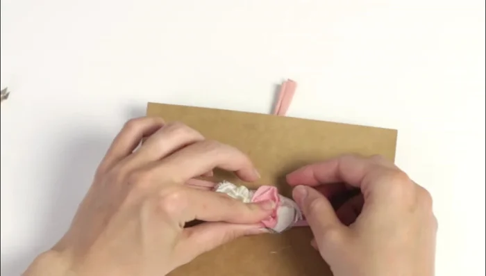 Glue the chiffon flower to the headband next to the white flower. Add pearls and dry flowers as desired.