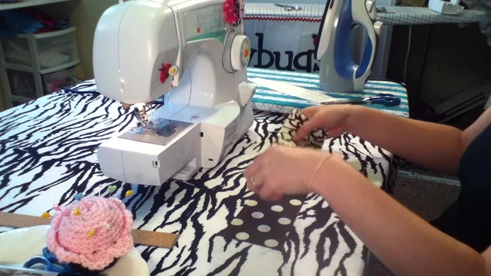 Fold over a 1/4 inch seam allowance on one end for a neat finish and iron it.