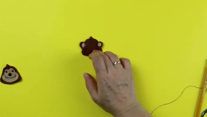 Sew around the headpiece, leaving a gap for stuffing. Use pins or glue to hold pieces together while sewing.