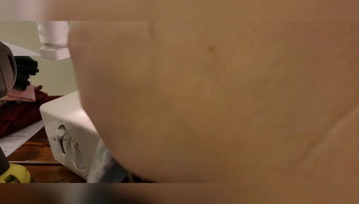 Sew the side seams, right sides together, using a serger or sewing machine. Ensure the bottom edges are precisely aligned and that the seam allowance is consistent (half inch).