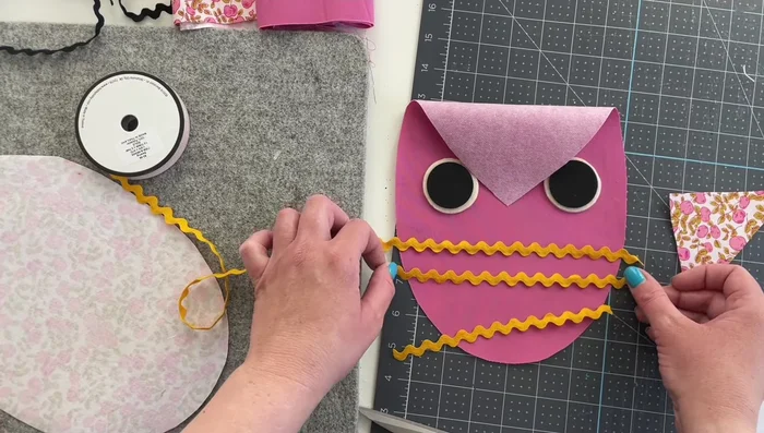 Attach eyes: Add eyes to the owl's face (using fabric glue or sewing).
