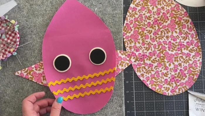 Attach wings: Pin and sew the wings to the front body piece, aligning with the pattern markings.