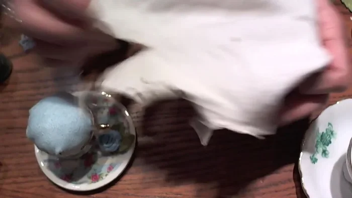 Prepare the pincushion filling: Cut a 6-inch square from an old t-shirt. Fold it repeatedly to create a ball, aiming for an even, asymmetrical top to avoid creases.