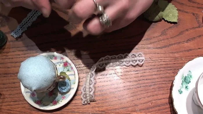 Attach to teacup: Apply E6000 glue to the inside edge of the teacup, avoiding the very lip. Carefully press the fabric ball into the glue, ensuring an even fit.