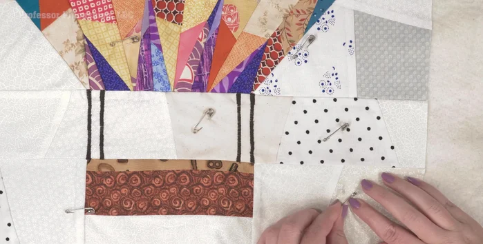 If not using spray basting, use quilt safety pins to secure all three layers together, spacing them every few inches.