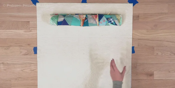 If not using spray basting, use quilt safety pins to secure all three layers together, spacing them every few inches.