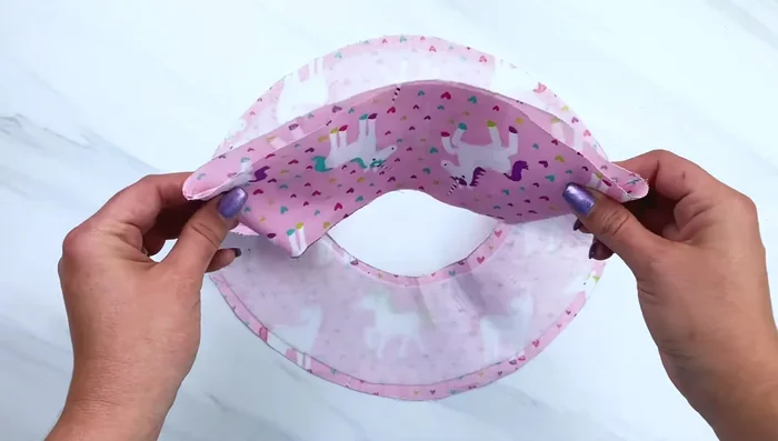 Attach the brim to the crown by matching the slits and sewing all around.