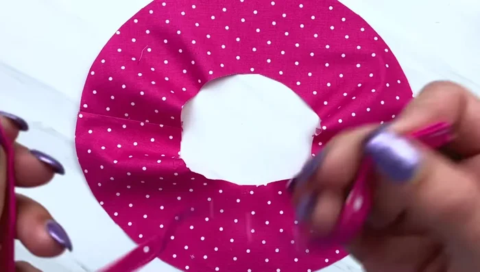 Attach ties to the inside of the hat with basting stitches.