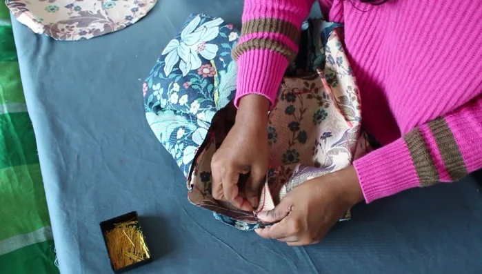 Pin the two circles to the middle part of the cushion and sew together, stitching twice for extra strength.