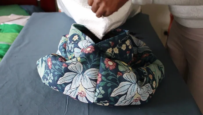 Fill the cushion with bean bag filling (or alternative) and stitch the zipper opening closed.